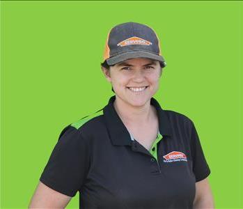 SERVPRO employee in front of green background